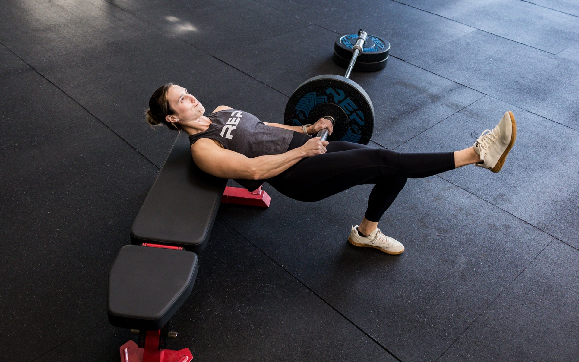 An athlete working out with the Free Standing REP® x Kleva Built® Adroit Landmine and a REP adjustable bench