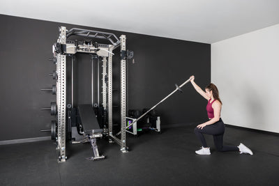 An athlete using the Kleva Adroit attached to the PR-5000 rack for a shoulder workout